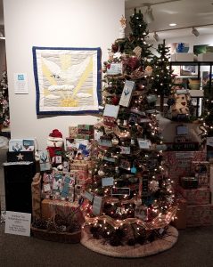 STIC is getting in the Christmas spirit with decorating a tree for the Roberson Museum